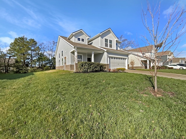 view of front of home with a front lawn and a garage