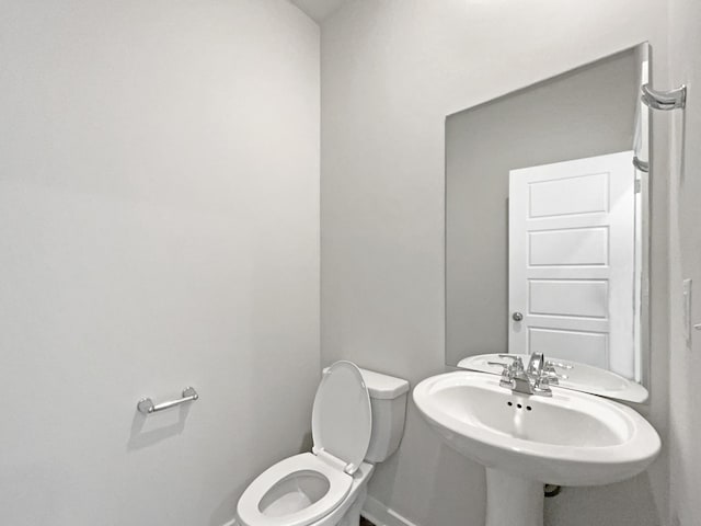 bathroom with toilet and sink