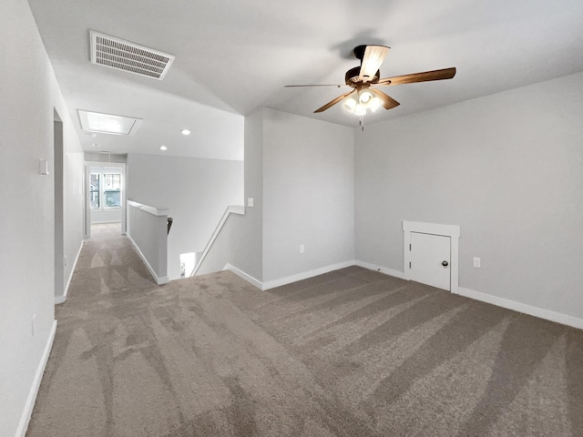 spare room with light carpet and ceiling fan