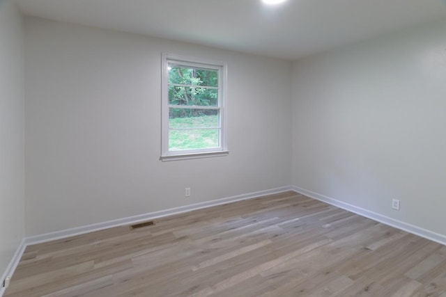 unfurnished room with light hardwood / wood-style flooring