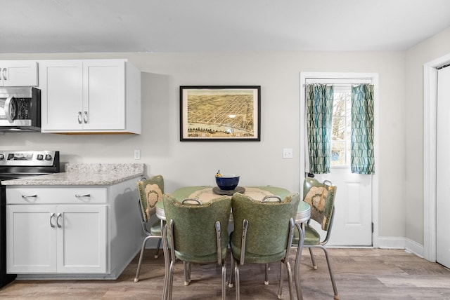 dining area featuring light hardwood / wood-style floors