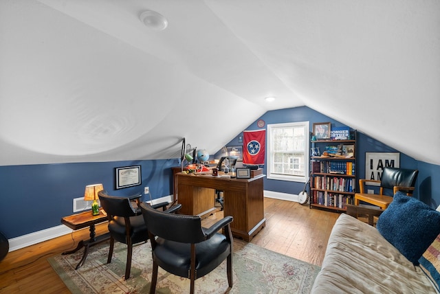 office featuring wood-type flooring and lofted ceiling