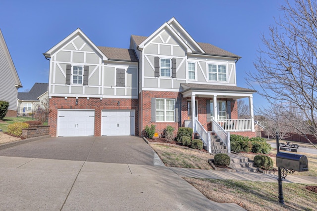 view of front of home featuring a porch and a garage