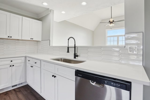 kitchen featuring sink, dark hardwood / wood-style floors, white cabinets, stainless steel dishwasher, and kitchen peninsula