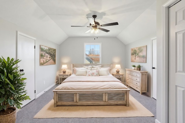 carpeted bedroom featuring lofted ceiling, ceiling fan, and baseboards