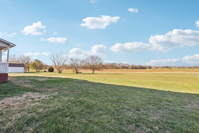 view of yard with a rural view