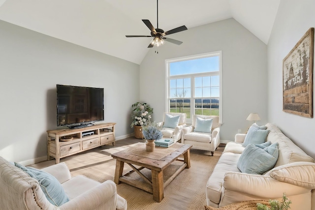 living room with light wood-type flooring, ceiling fan, baseboards, and vaulted ceiling