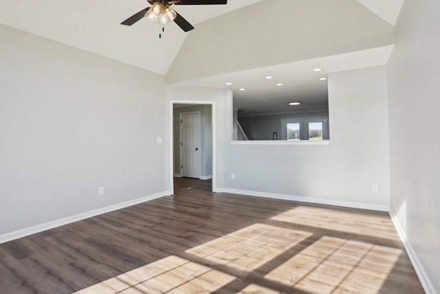 spare room featuring baseboards, a ceiling fan, wood finished floors, high vaulted ceiling, and recessed lighting