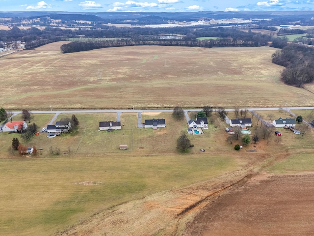 birds eye view of property with a rural view