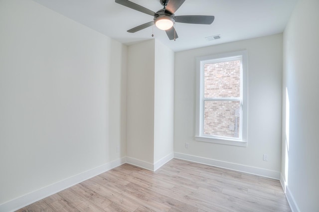 unfurnished room featuring ceiling fan and light wood-type flooring