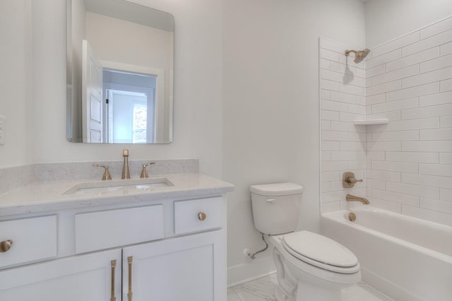 full bathroom featuring vanity, toilet, and tiled shower / bath