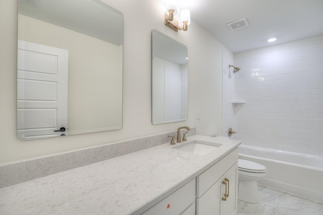 full bathroom with tiled shower / bath combo, toilet, and vanity