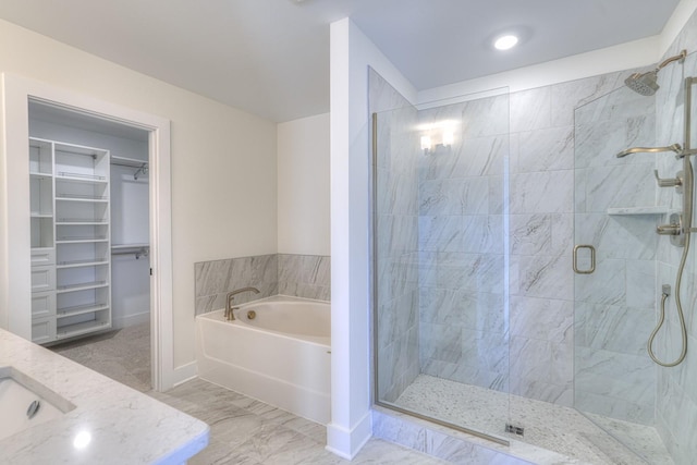 bathroom with sink and plus walk in shower