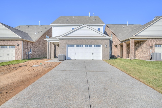 view of front of house featuring central air condition unit and a front lawn