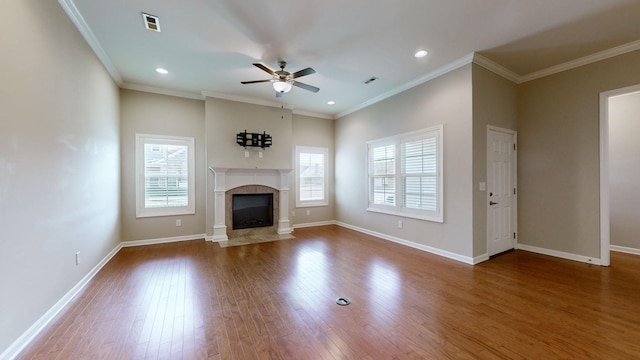 unfurnished living room with ceiling fan, wood-type flooring, and ornamental molding