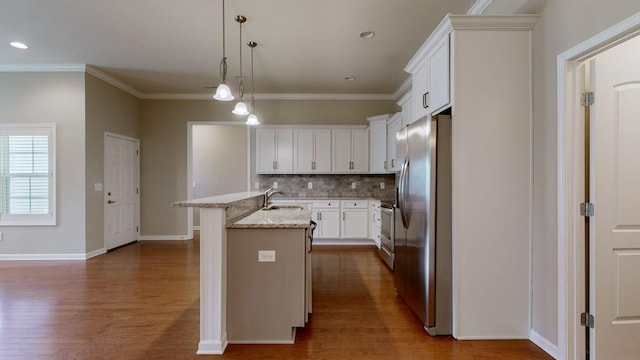 kitchen with white cabinetry, light stone countertops, an island with sink, pendant lighting, and appliances with stainless steel finishes