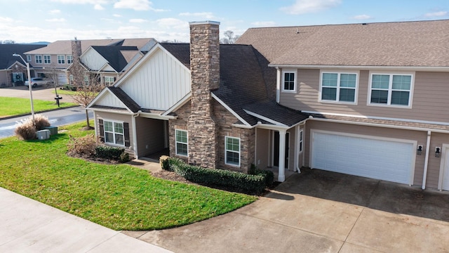 view of front of home with a garage and a front yard