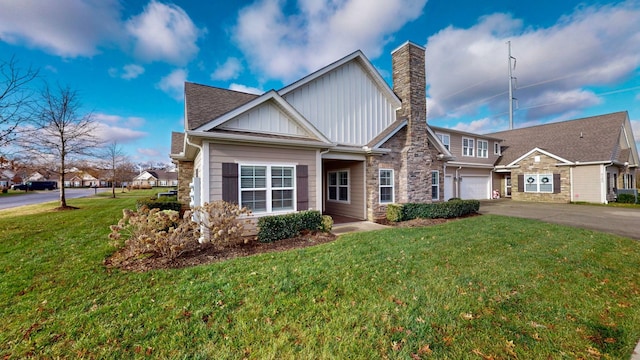 view of front of house featuring a garage and a front lawn