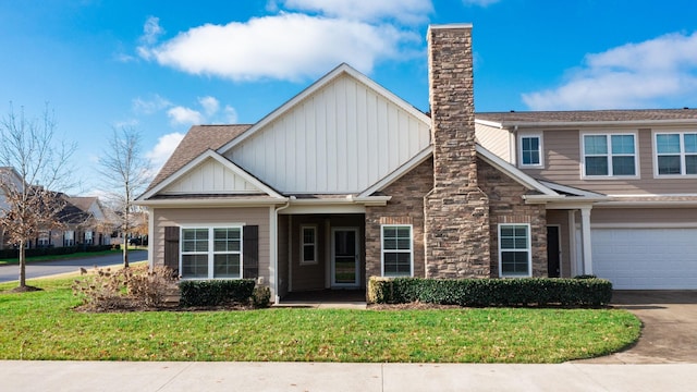 craftsman-style house with a front lawn and a garage