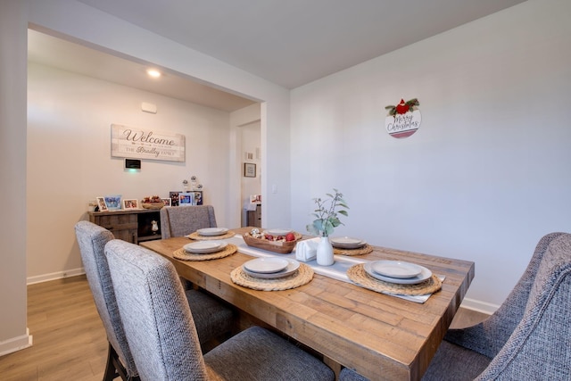 dining space featuring hardwood / wood-style floors