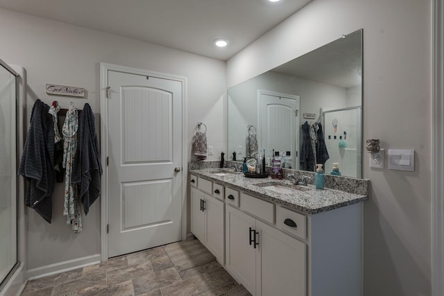 bathroom with vanity and walk in shower