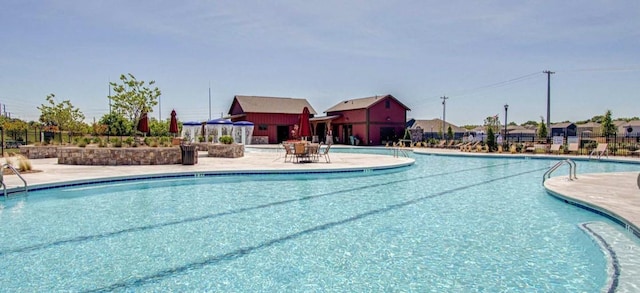 view of swimming pool featuring a patio