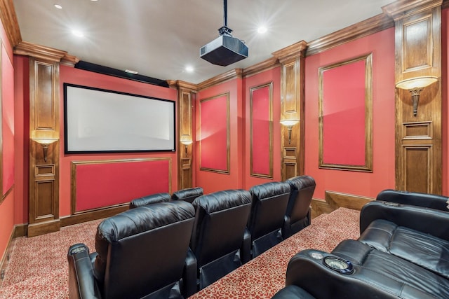 carpeted cinema room with crown molding