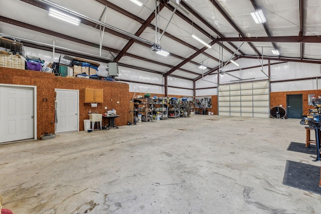 garage featuring wood walls