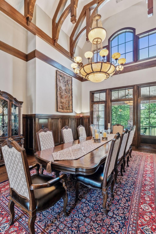 dining room featuring a high ceiling and a notable chandelier