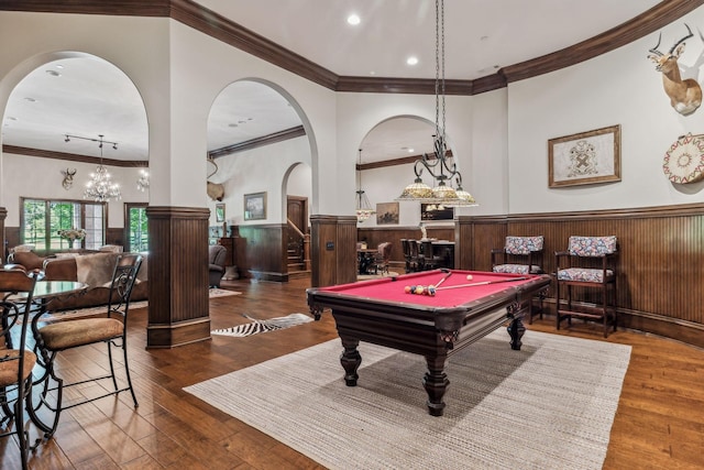 playroom with dark hardwood / wood-style flooring, crown molding, and billiards