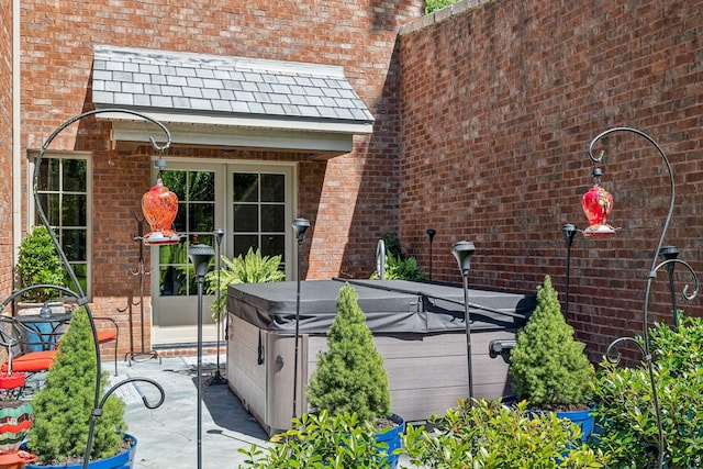 exterior space with a patio and a hot tub