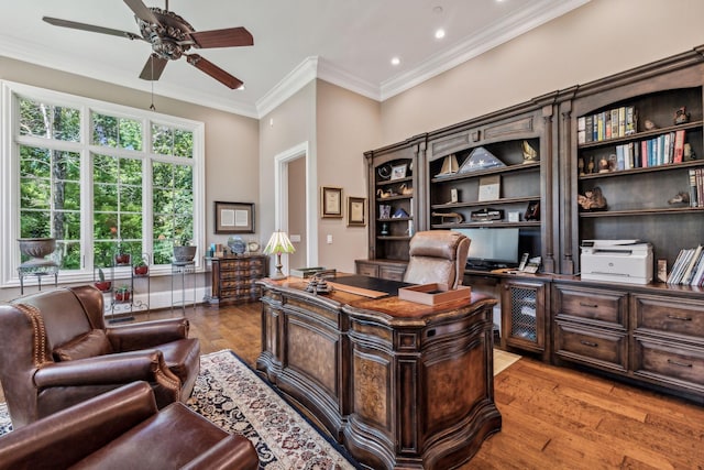 home office featuring ceiling fan, light hardwood / wood-style floors, and ornamental molding