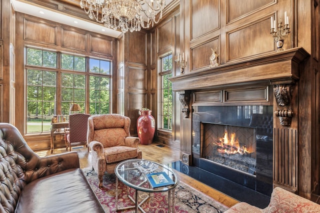 sitting room with a tiled fireplace and wood walls