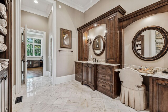 bathroom with vanity and crown molding