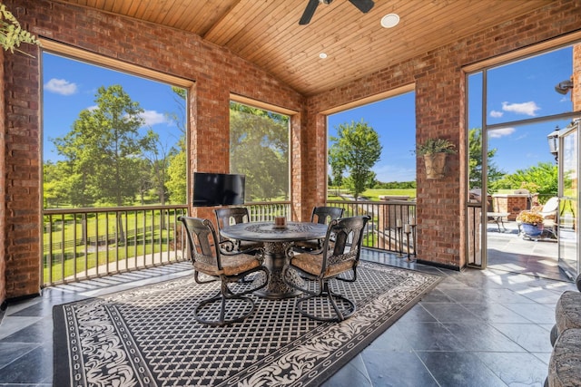 sunroom / solarium with wooden ceiling, ceiling fan, and lofted ceiling