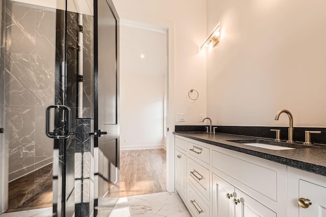 bathroom with vanity and a shower with shower door