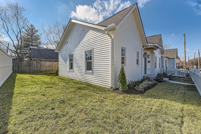 view of property exterior with a lawn