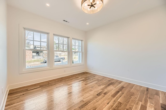 empty room featuring hardwood / wood-style flooring