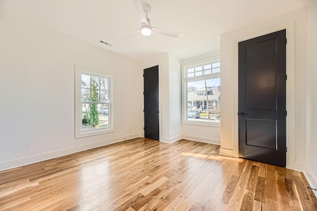 interior space with ceiling fan and light hardwood / wood-style floors