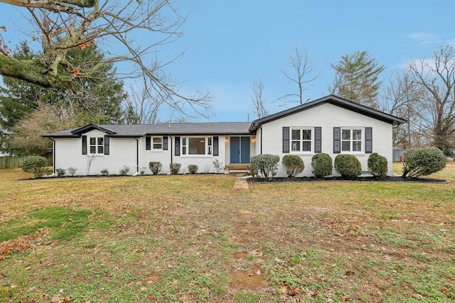 single story home featuring a front yard