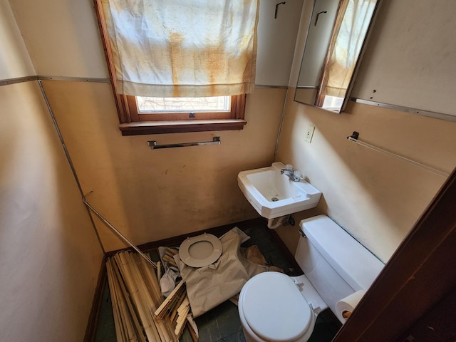 bathroom with tile patterned floors, sink, and toilet