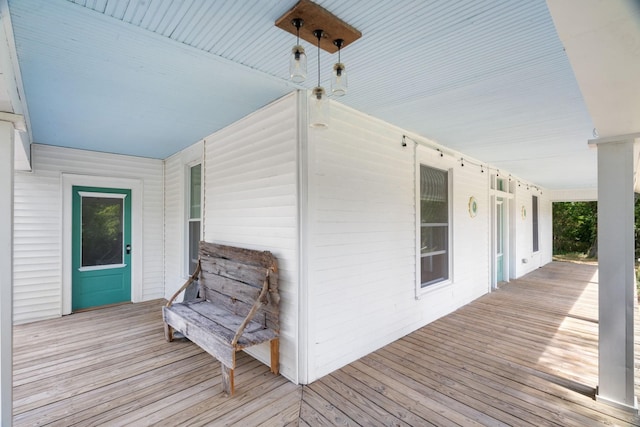 wooden terrace with a porch