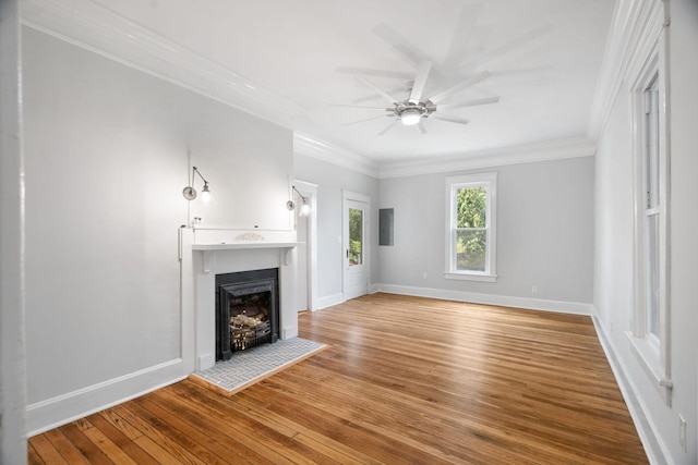 unfurnished living room with wood-type flooring, electric panel, ceiling fan, and ornamental molding