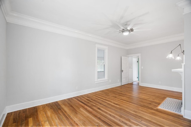 spare room featuring hardwood / wood-style floors, ceiling fan, and ornamental molding