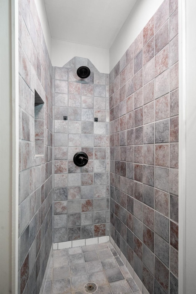 bathroom with tiled shower