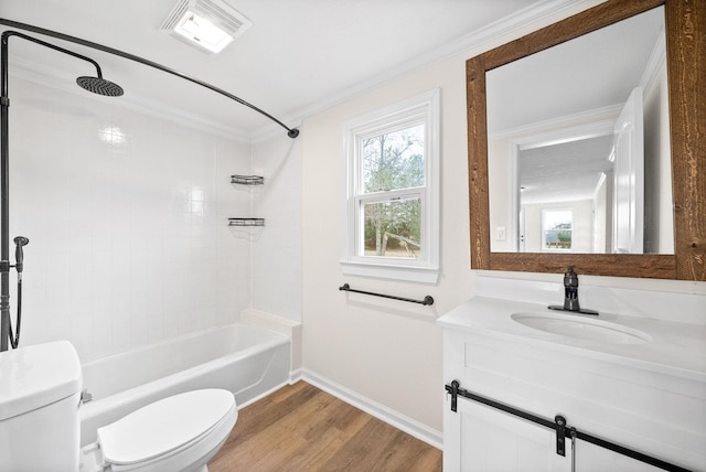 full bathroom featuring tiled shower / bath combo, crown molding, toilet, vanity, and hardwood / wood-style flooring