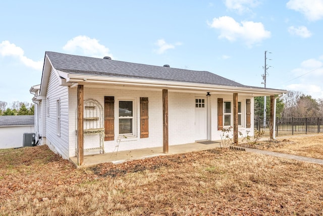 view of front of property featuring a porch and central AC