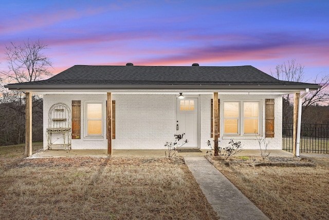 view of front of property with a yard