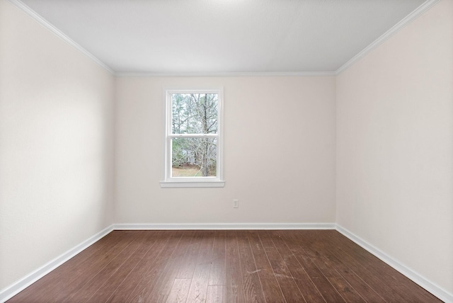 spare room featuring hardwood / wood-style flooring and ornamental molding
