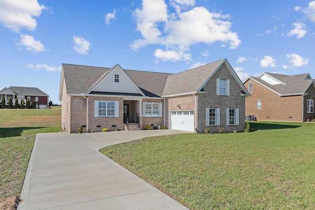 view of front of property with a garage and a front lawn